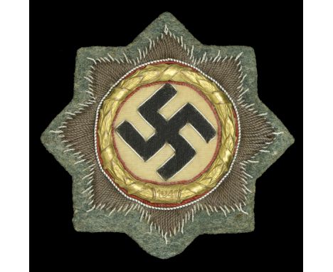 A German Second World War Cloth German Cross in Gold. A nice example of the cloth version of the German Cross in Gold with ar