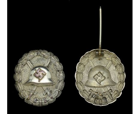 A M.1936 Spanish Civil War Wound Badge in Silver. A hollow back example, with round pin. Very slight tarnishing, and silver o