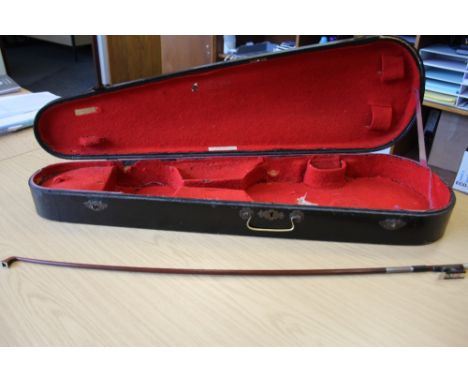 A silver mounted violin bow branded VF Fetique A Paris. Octagonal stick, full size, together with a violin case labelled W.E.