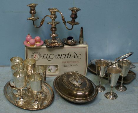 A quantity of assorted silver-plated wares including tureens, goblets, a bread basket and candelabra etc.