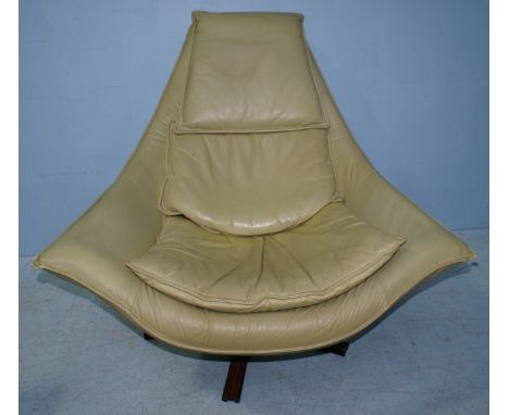 A pair of vintage, green leather upholstered swivel armchairs, raised on metal and rosewood bases, c.1970's.