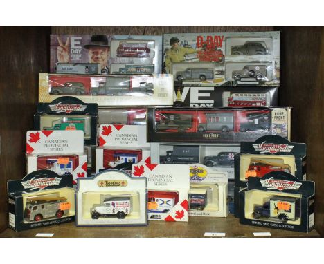 A collection of assorted boxed Lledo scale model vehicles including a Winston Churchill set with victory bus and a quantity o