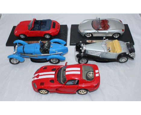 Five assorted modern scale model sports cars, including a Porsche 911 and a Dodge Viper etc.