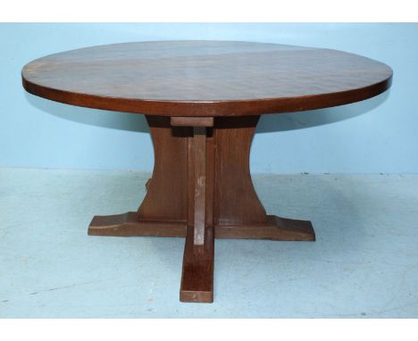 A Robert 'The Mouseman' Thompson circular oak dining table raised on cruciform base, with adzed top and carved mouse, 136cm d