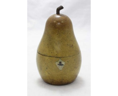 A wooden tea caddy shaped as a pear, with hinged top, zinc lined interior and lock and key