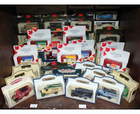 A good collection of assorted boxed Lledo scale model vans including Hamleys vans and military vehicles etc.