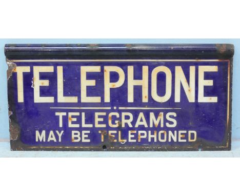 A blue and white enamel sign, 'Telephones - Telegrams May Be Telephoned,' 26x54cm