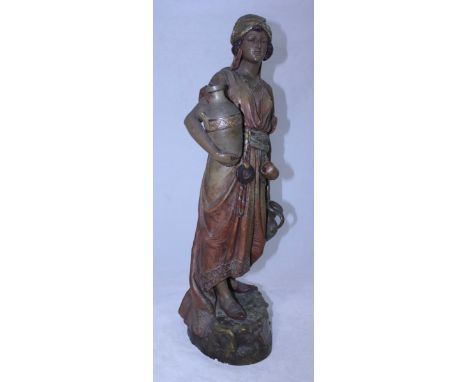 A 19th century large cold-painted terracotta figure of a Moorish water or wine carrier, possibly Goldscheider, unmarked, 64cm