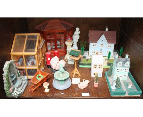 Four shelves of modern dolls house furnishings and fitting including five conservatories, garden ornaments and gardening tool