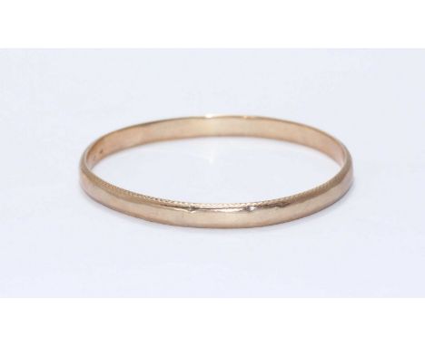 A ladies hollow 9ct gold bangle, 10.98g