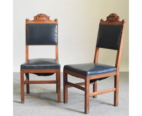 A set of four early 20th century light oak dining chairs, with upholstered seats and backs