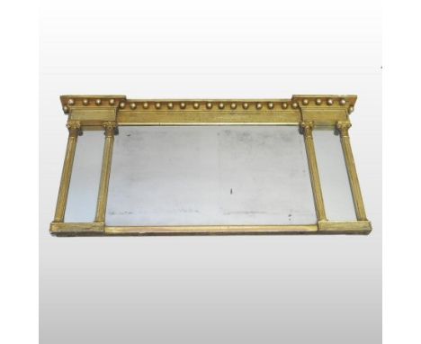A Regency carved pine and gilt gesso wall mirror, the moulded cornice with ball ornament, flanked by marginal panels, 59 x 11