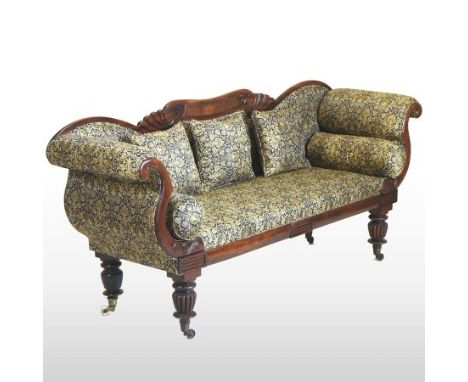 A Regency mahogany framed and silk upholstered scroll end sofa, upholstered with gold and blue floral palmette fabric, with m