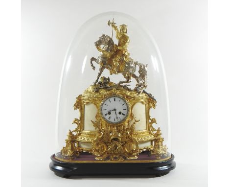 A 19th century continental gilt spelter mantel clock, surmounted by a figure on horseback, the enamel dial showing Roman hour