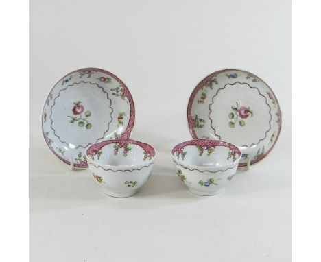 A pair of 18th century New Hall porcelain tea bowls and saucers, circa 1780, each decorated with flowers 