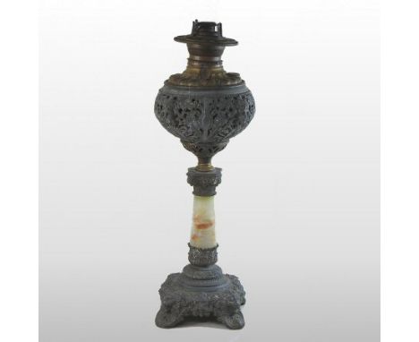 A 19th century American marble and brass oil lamp, with an ornate metal reservoir and scrolled base, 56cm high