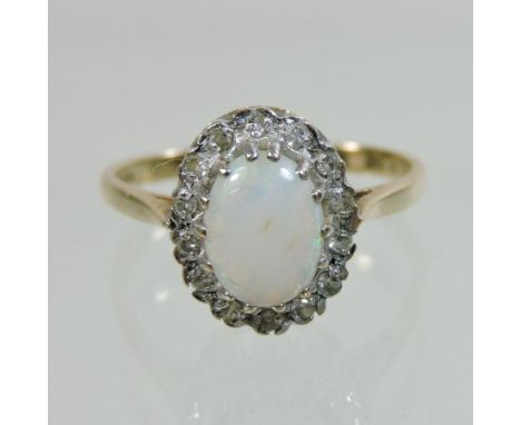 A 9 carat gold opal and diamond cluster ring