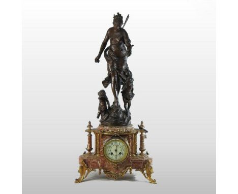 A 19th century French gilt metal mounted marble figural mantel clock, surmounted by three fairies, bearing a label inscribed 