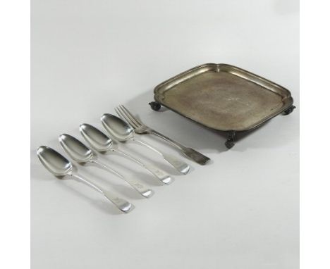 An early 20th century silver waiter, of square shape, on scrolled feet, Sheffield 1939, 19cm wide, together with a set of fou