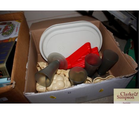 A collection of vintage Tupperware, jelly moulds etc.
