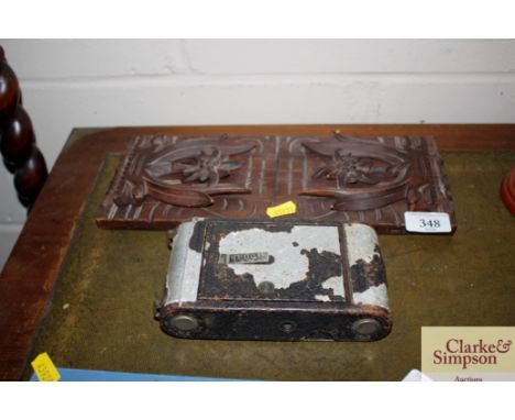 A carved expanding book rack; and a vintage Kodak camera 