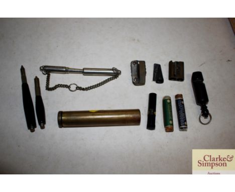 A small horn vintage whistle; vintage pen sharpeners pens etc.
