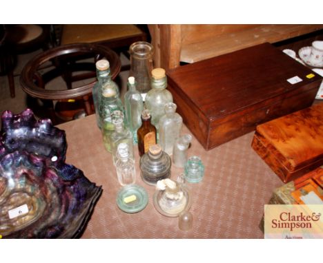 A collection of assorted vintage glass bottles etc. 