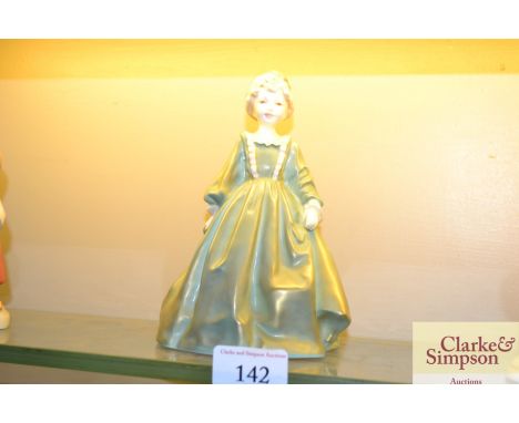 A Royal Worcester figurine by F.G. Doughty "Grandmother's Dress"