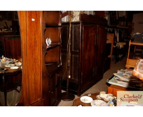 An oak standard lamp with shade; and a copper warming pan with turned wooden handle 