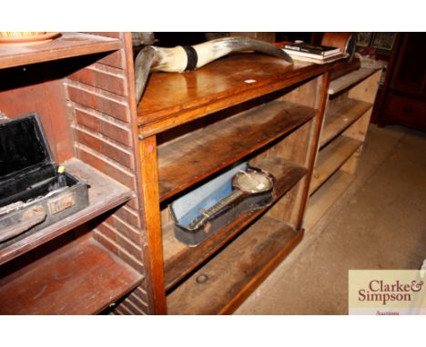 A Victorian light oak open fronted bookcase