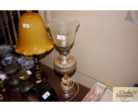 A converted silver plated lamp with glass shade 