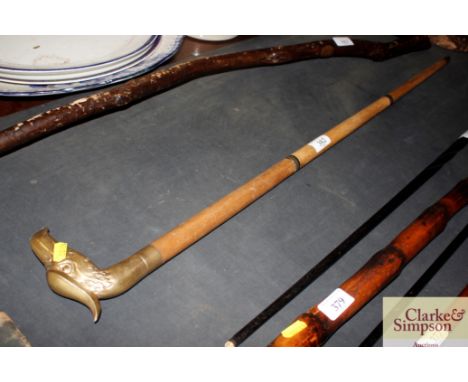 A large eagle topped brass walking stick 