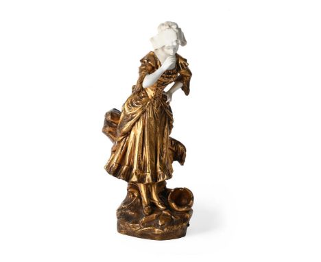 MEDNOT, A GILT METAL AND BISQUE PORCELAIN FIGURE 'LA CRUCHE CASSEE'  FRENCH, EARLY OR MID 20TH CENTURY  Modelled as a milkmai