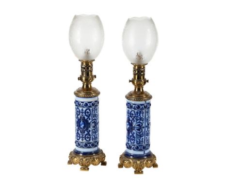 A PAIR OF GILT METAL AND MOUNTED STONEWARE TABLE LAMPS INCORPORATING LATE 19TH CENTURY ELEMENTS, 20TH CENTURY  possibly Germa