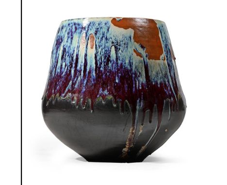 A CHINESE POLYCHROME GLAZED PLANTER  20TH CENTURY Of large proportion,  65cm high 48cm wide at the aperture   Provenance: Gui