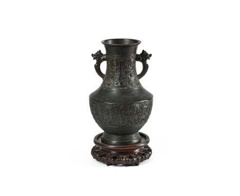 A CHINESE BRONZE TWIN-HANDLED VASE 17TH CENTURY, MING DYNASTY 30cm high, 20cm diameter, base 17cm diameter   Condition Report