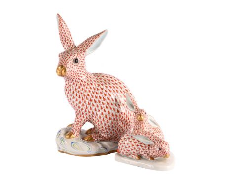 A HEREND MODEL OF A RABBIT, AND A SMALLER MODEL OF A PAIR OF RABBITS SECOND HALF 20TH CENTURY the taller 30.5cm high, 20cm wi