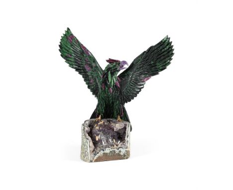 A MODEL OF A ZOISITE EAGLE ON AN AMETHYST AND QUARTZ GEODE 20TH CENTURY  50.5cm high, 47cm high, 23cm   Provenance: Private C