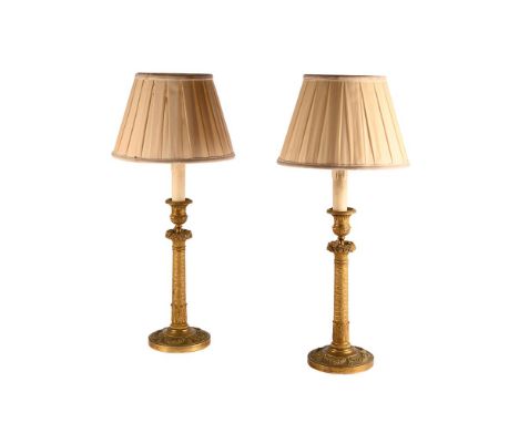 A PAIR OF GILT METAL CANDLESTICK LAMP BASES 19TH CENTURY  later converted  47cm high, 14cm diameter  Condition Report:  PLEAS