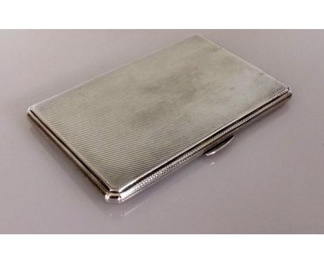 An Art Deco silver cigarette case with engine turned decoration, initialled to inside, hallmarked for W T Toghill &amp; Co., 