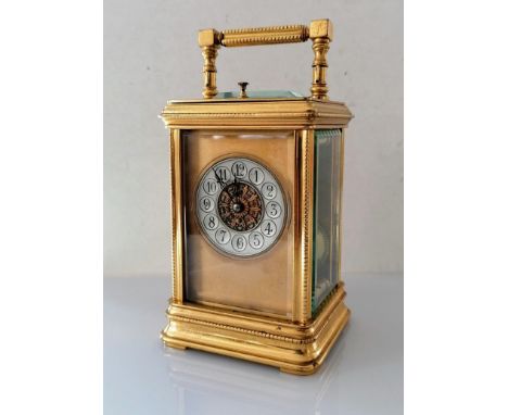 A larger 19th century French gilt brass repeating carriage clock, silvered chapter ring with French Arabic numerals and appli