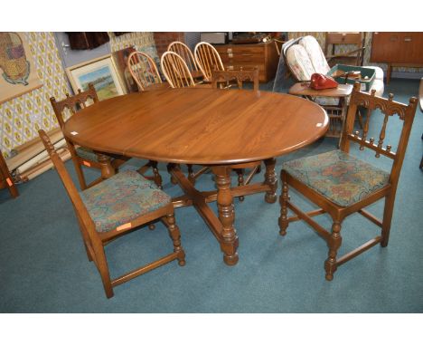 Ercol Oval Extending Dining Table with Four Matching Chairs 