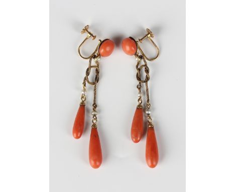 A pair of gold, coral and seed pearl pendant earrings, circa 1920, each with a coral bead surmount above two graduated coral 