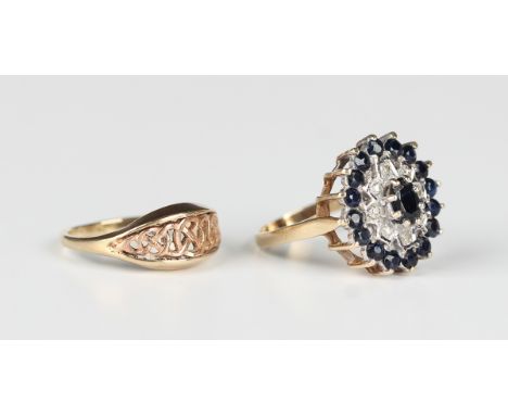 A 9ct gold, sapphire and diamond oval cluster ring, claw set with the principal oval cut sapphire at the centre, ring size ap