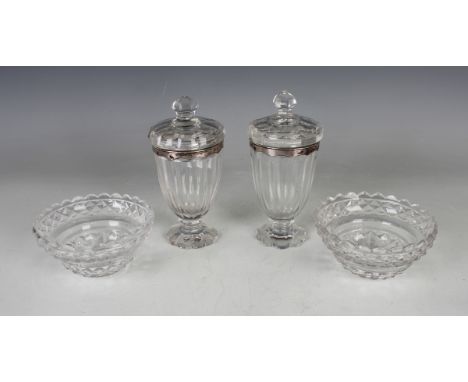 A pair of George III silver mounted cut glass preserve jars and covers, each with facet cut decoration, the silver rims with 