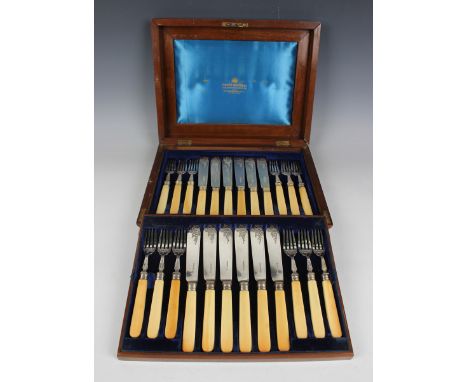 A set of twelve late Victorian silver and ivory handled fish knives and forks with engraved scroll decoration, Sheffield 1889