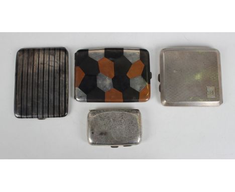 A sterling cigarette case with patinated 'patchwork' decoration, length 11cm, a silver and niello banded cigarette case and t