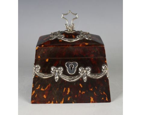 A late Victorian silver mounted tortoiseshell tea caddy of tapering rectangular form, the hinged lid with scroll handle and a