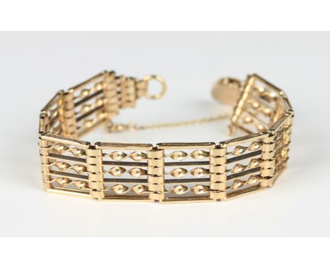A 9ct gold bar, twisted bar and oval link gate bracelet on a 9ct gold heart shaped padlock clasp, Birmingham 1979, weight 19.