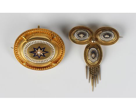 A Victorian gold, enamelled and half-pearl set oval brooch in a Neoclassical Revival design, mounted with the single half-pea